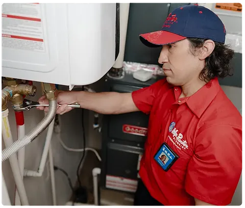 Plumber repairing a water heater