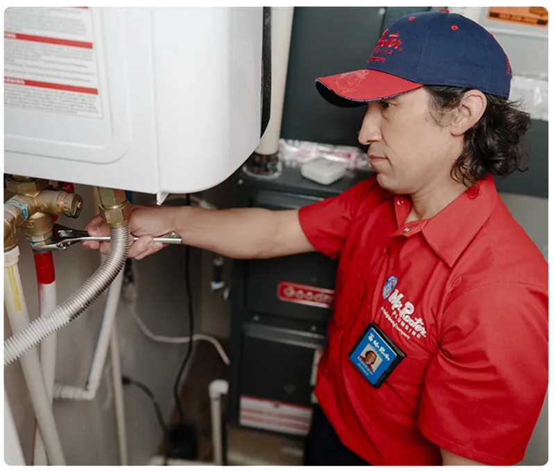 Plumber repairing a water heater