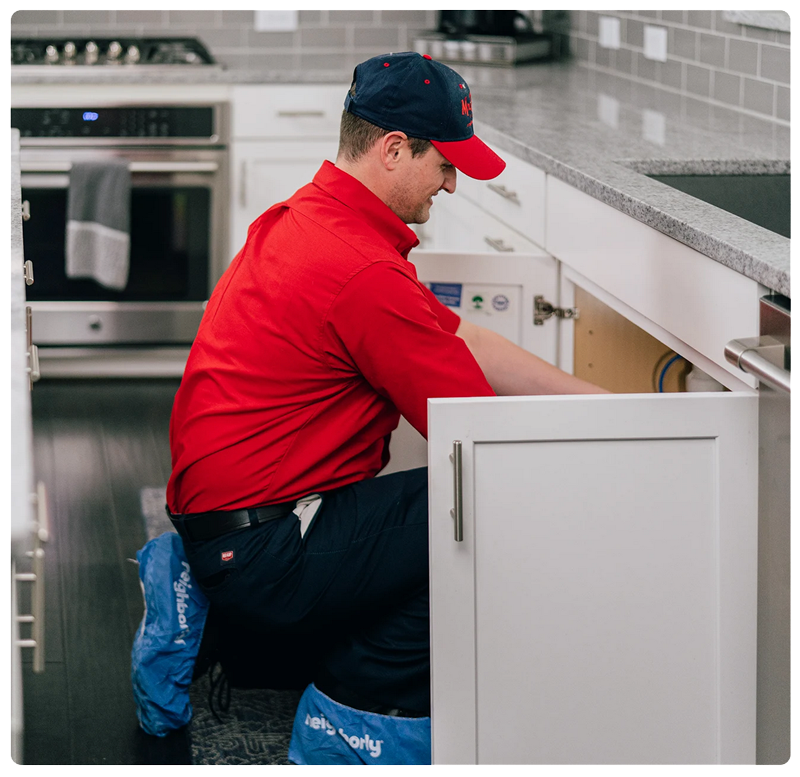 Plumber working on a sink